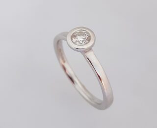 Striking Bezel Set Diamond Solitaire