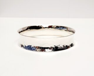 Planished concave silver bangle
