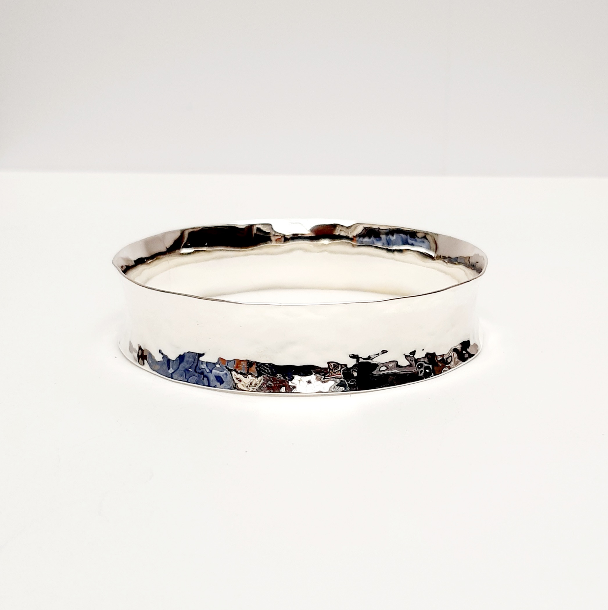 Planished concave silver bangle
